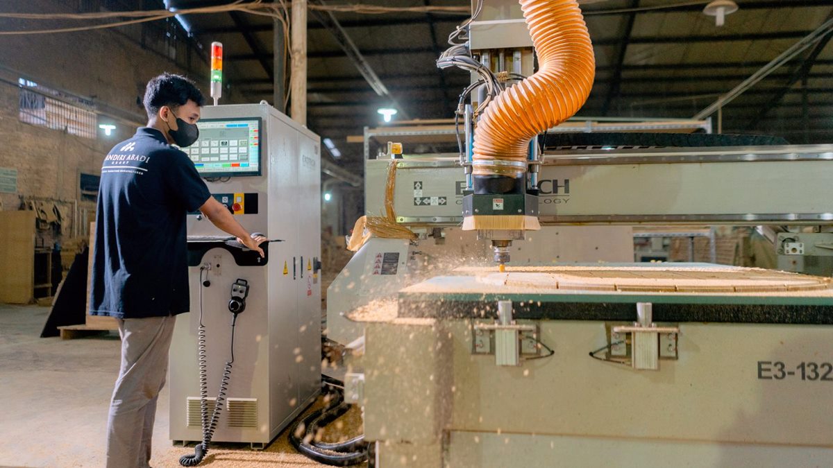 Board components being cut and shaped on the production line